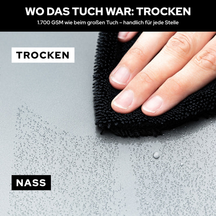 KULT Trockentuch S unter der Hand auf nassem Lack: wo das Tuch war, ist es trocken, daneben noch Tropfen